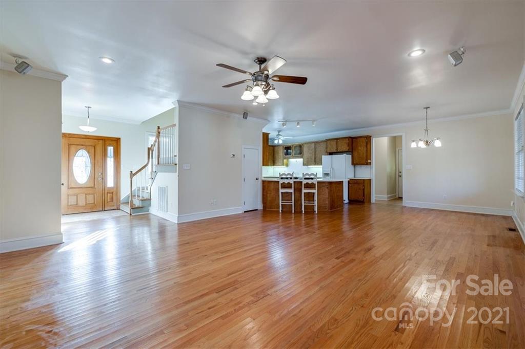 4503 Davis Road Edgemoor, SC 29712 - Photo 7 of 21 a view of a work space with wooden floor and a kitchen