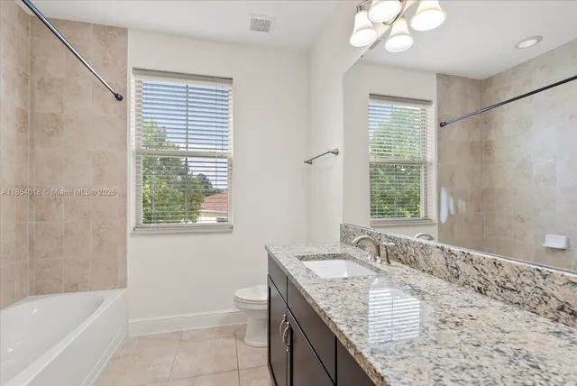 an empty room with a empty space and a ceiling fan