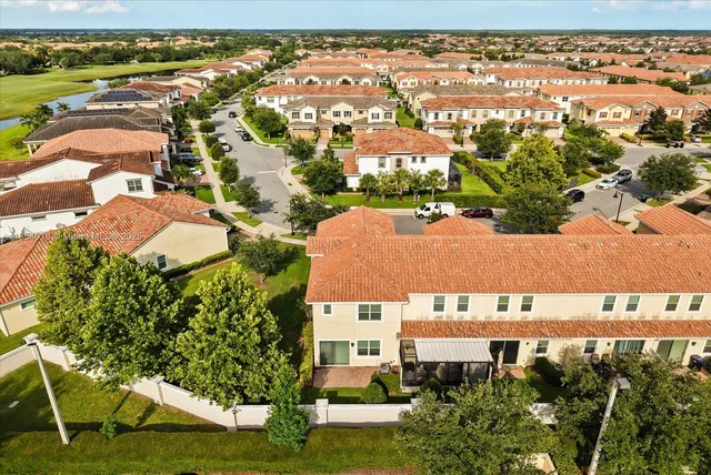 an aerial view of residential houses with outdoor space