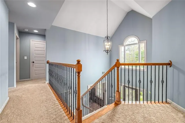 a view of a hallway with windows