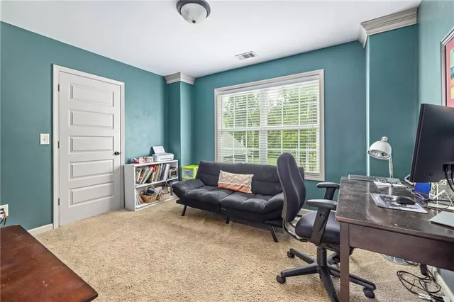 a workspace with furniture and a window