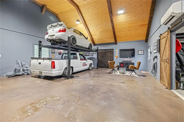 a view of a garage with rack and bicycle
