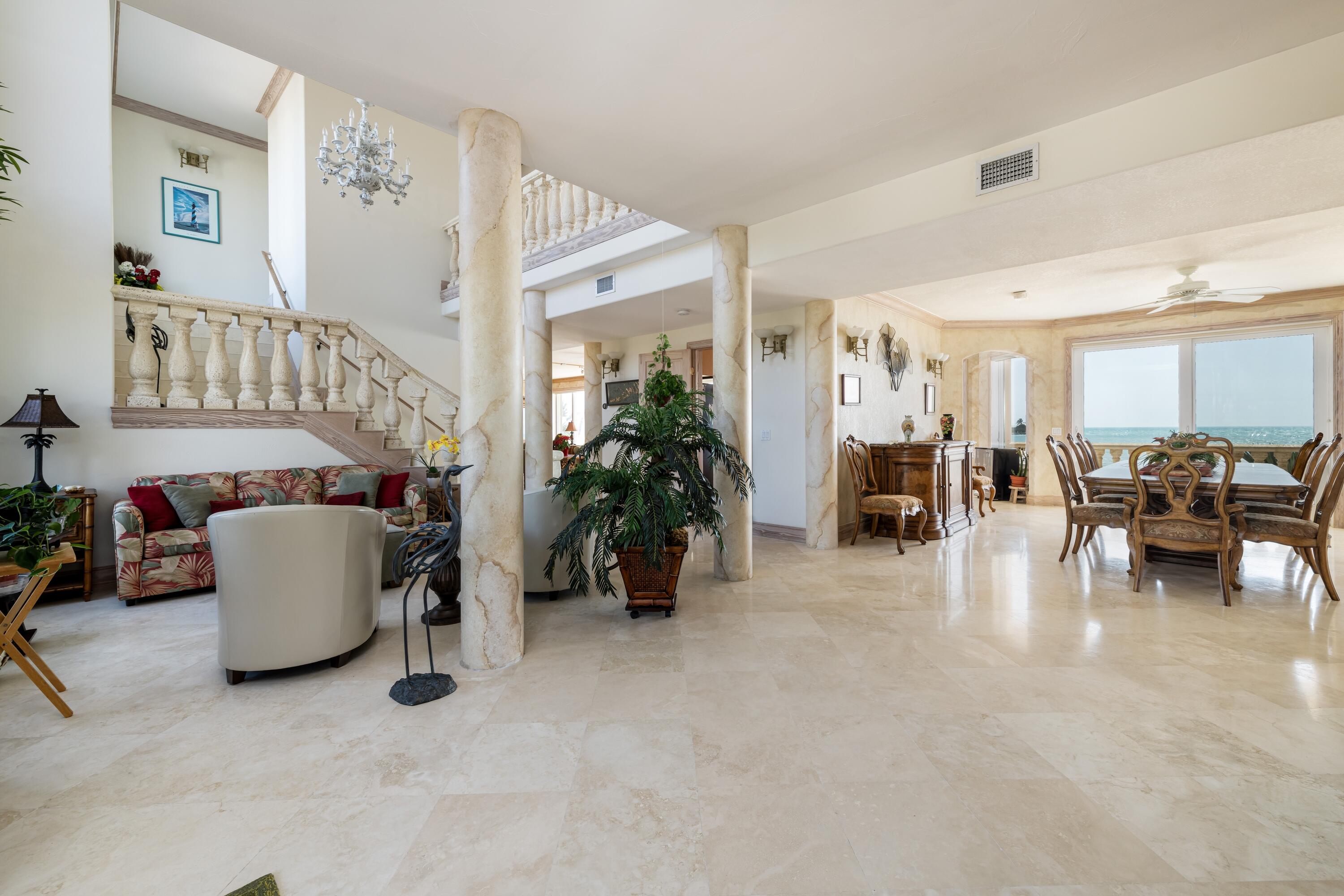 5 Ocean Drive East Marathon, FL 33050 - Photo 13 of 79 a living room with furniture and a dining table with potted plant