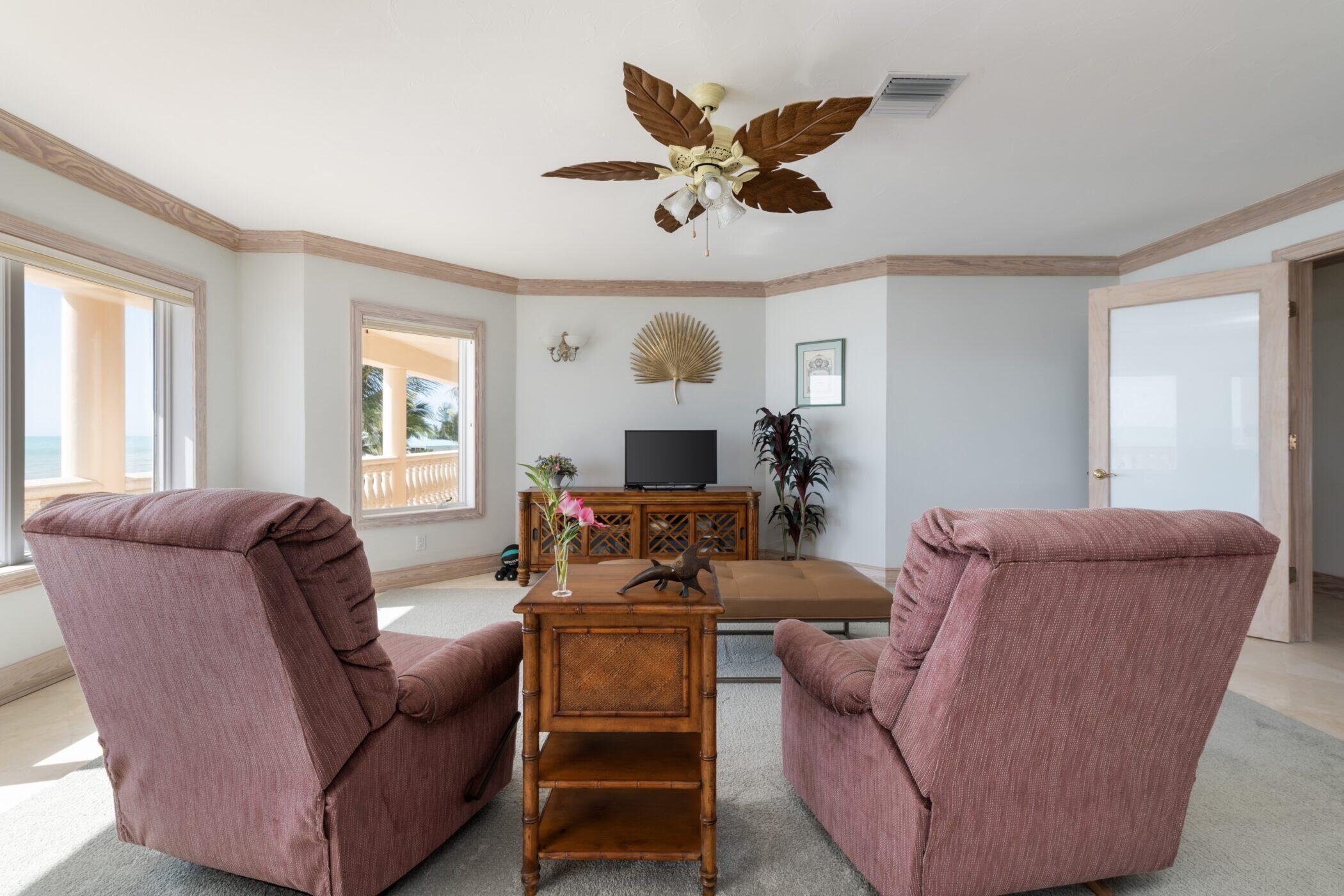 5 Ocean Drive East Marathon, FL 33050 - Photo 33 of 79 a living room with furniture and a large window