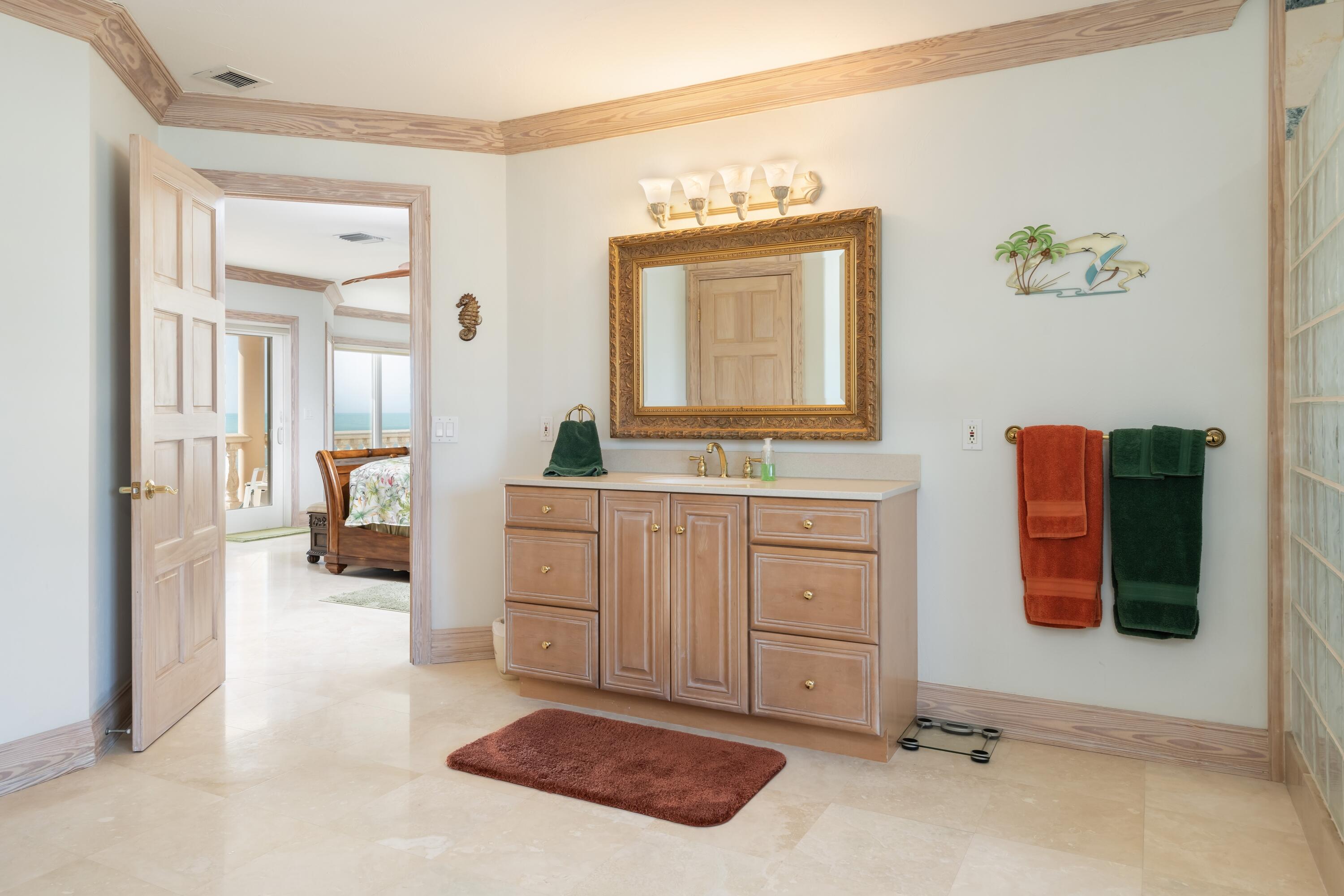 5 Ocean Drive East Marathon, FL 33050 - Photo 38 of 79 a spacious bedroom with a bed and a dresser