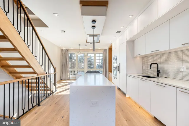 a bathroom with a glass shower door and a mirror
