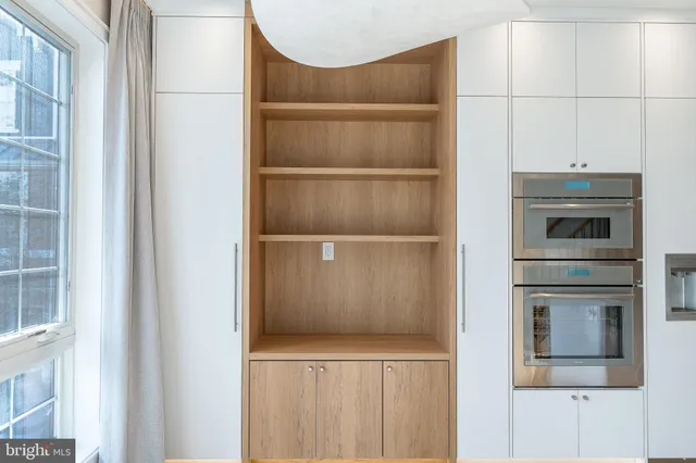 a view of a storage & utility room with a window
