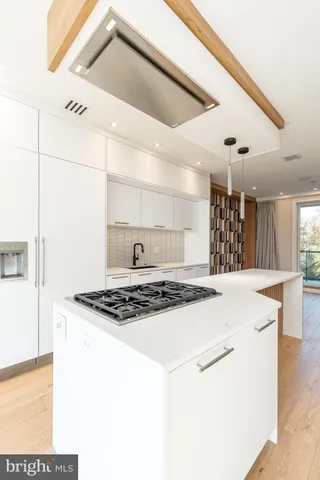 a large kitchen with cabinets