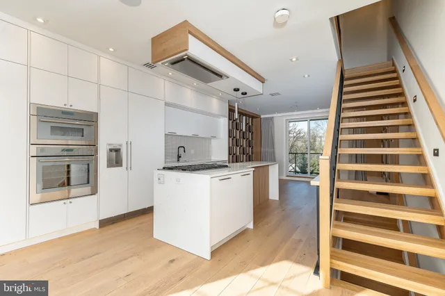 a bathroom with a sink a mirror and shower view