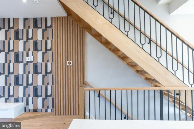 an aerial view of residential houses with a city view
