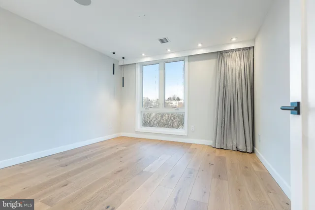 a kitchen with stainless steel appliances a stove and a refrigerator