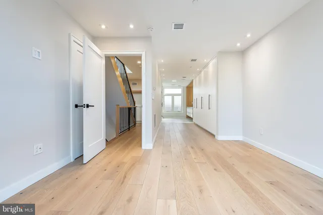 a view of balcony with wooden floor and outdoor seating