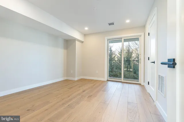 a kitchen with stainless steel appliances a sink a stove and a refrigerator