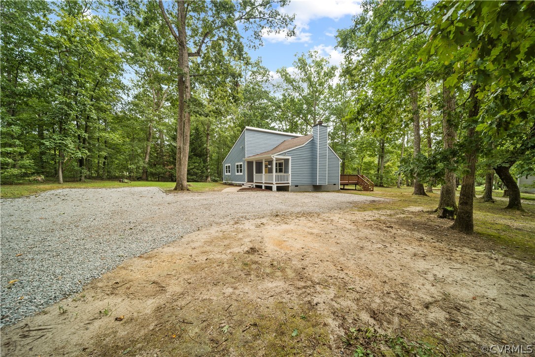 10911 Berrand Road North Chesterfield, VA 23236 - Photo 39 of 44 a house with trees in front of it