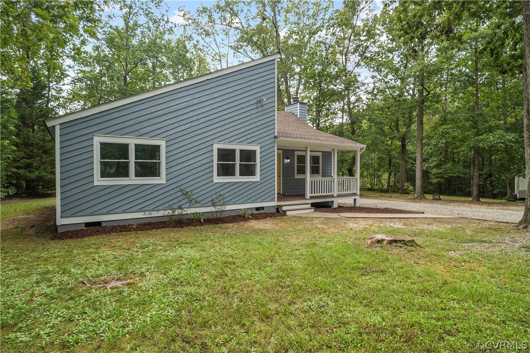 10911 Berrand Road North Chesterfield, VA 23236 - Photo 41 of 44 a view of a house with a yard and sitting area