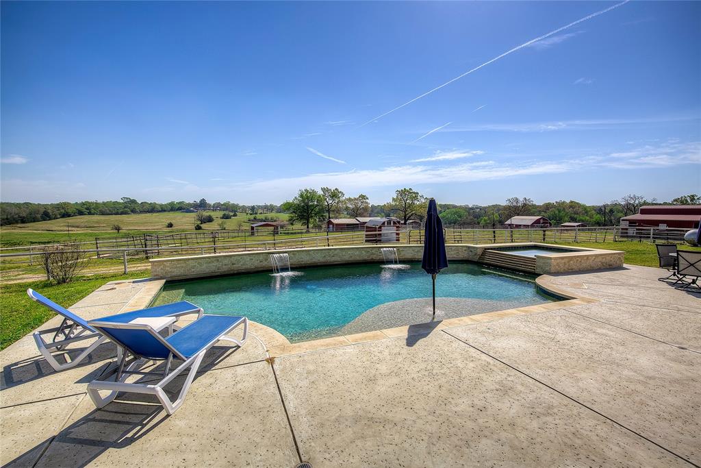 7359 Highway 154 Sulphur Springs, TX 75482 - Photo 31 of 40 Another view of pool and hot tub, with barns and pastures beyond.