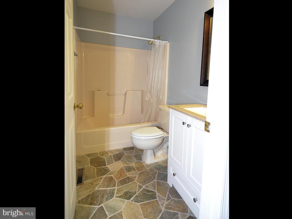 627 Jonathan Road Linden, VA 22642 - Photo 17 of 30 Main floor hall bath w/ceramic tile