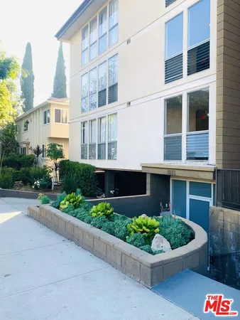 a front view of a multi story residential apartment building