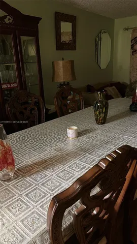 a bedroom with a bed and mirror