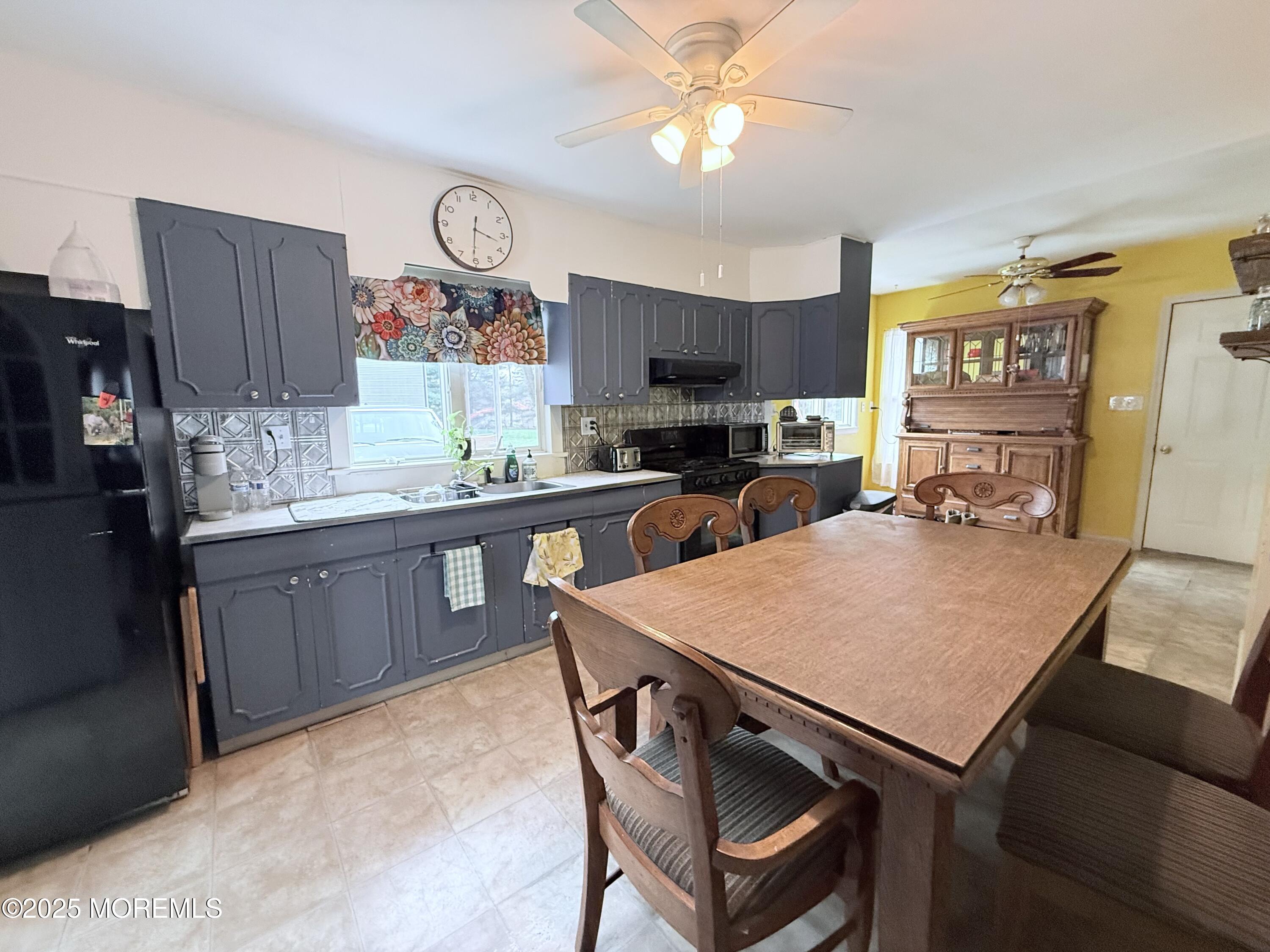 479 Line Road Matawan, NJ 07747 - Photo 15 of 32 a kitchen with stainless steel appliances granite countertop a sink dishwasher a stove a refrigerator a microwave oven with cabinets and wooden floor