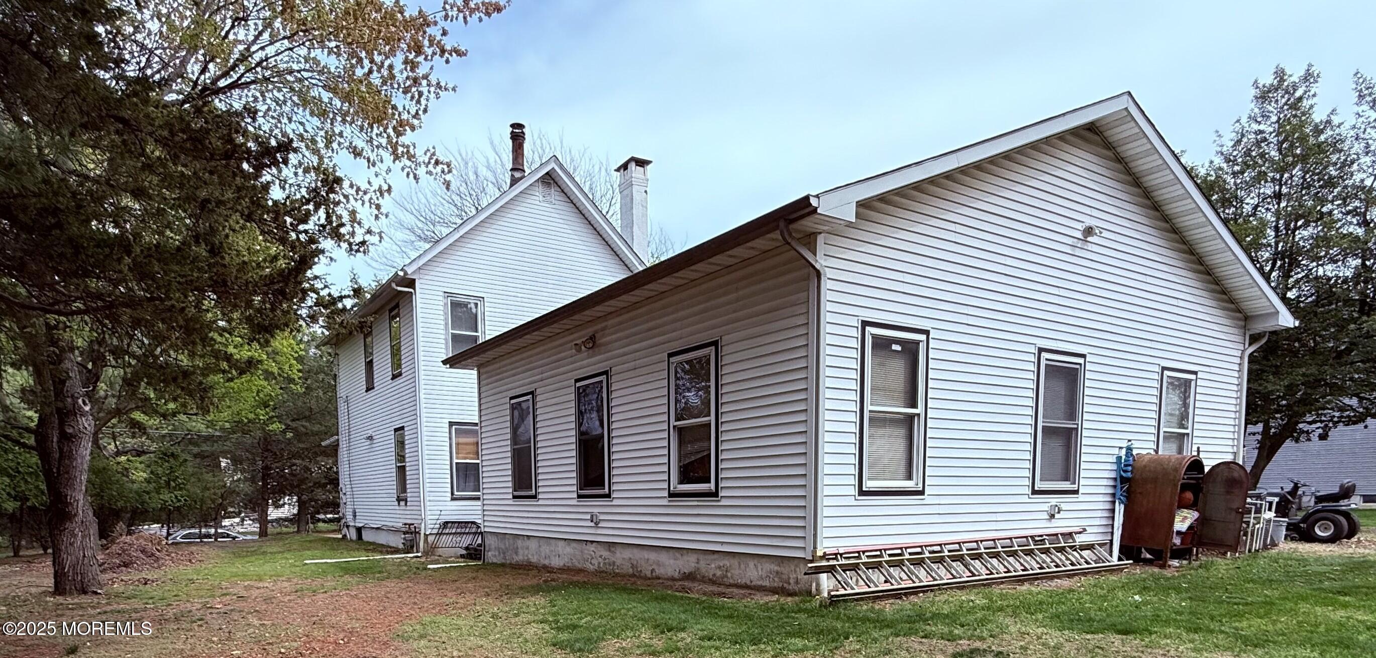 479 Line Road Matawan, NJ 07747 - Photo 2 of 32 a view of a house with a yard and wooden fence