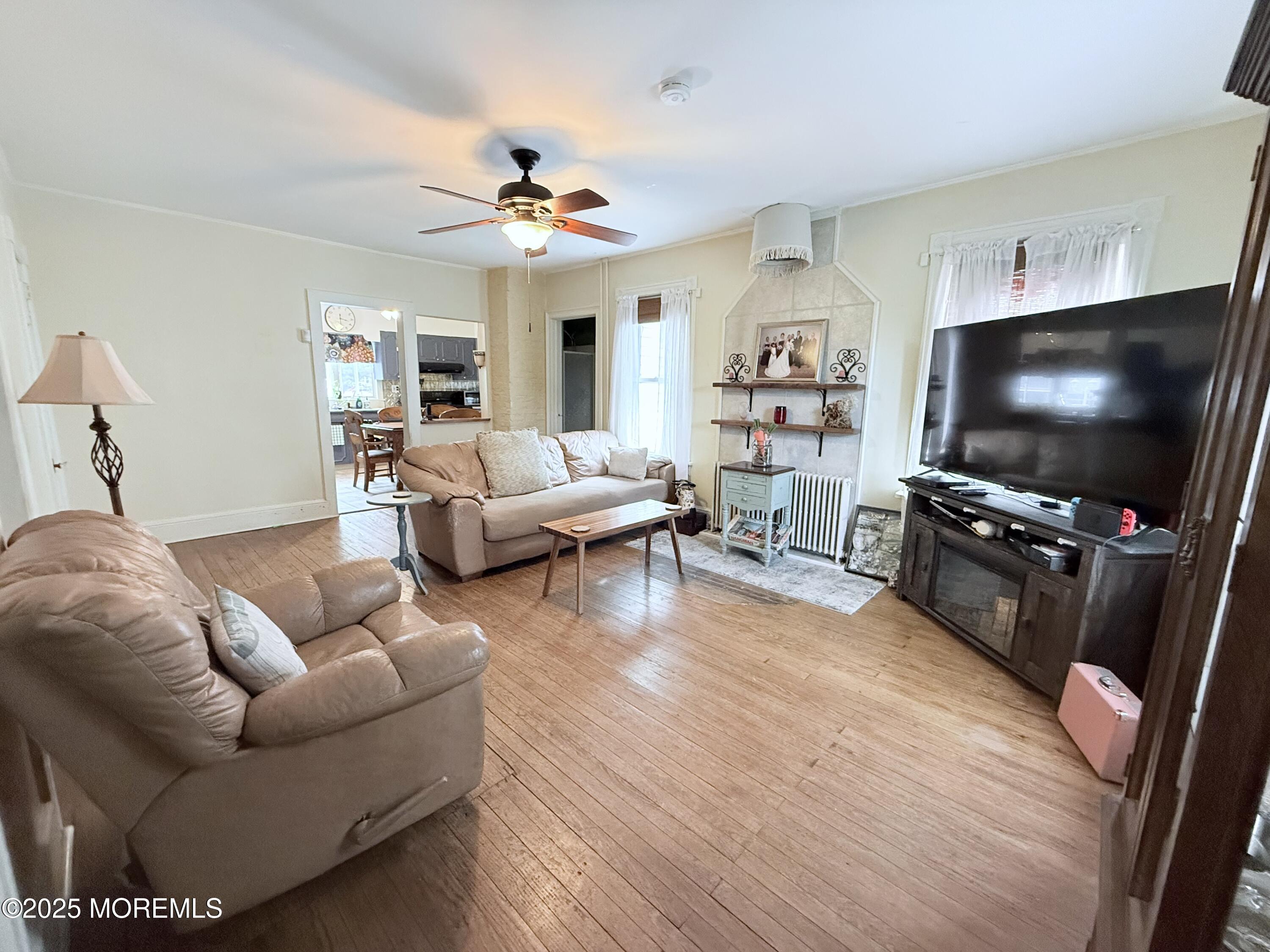 479 Line Road Matawan, NJ 07747 - Photo 21 of 32 a living room with furniture and a flat screen tv