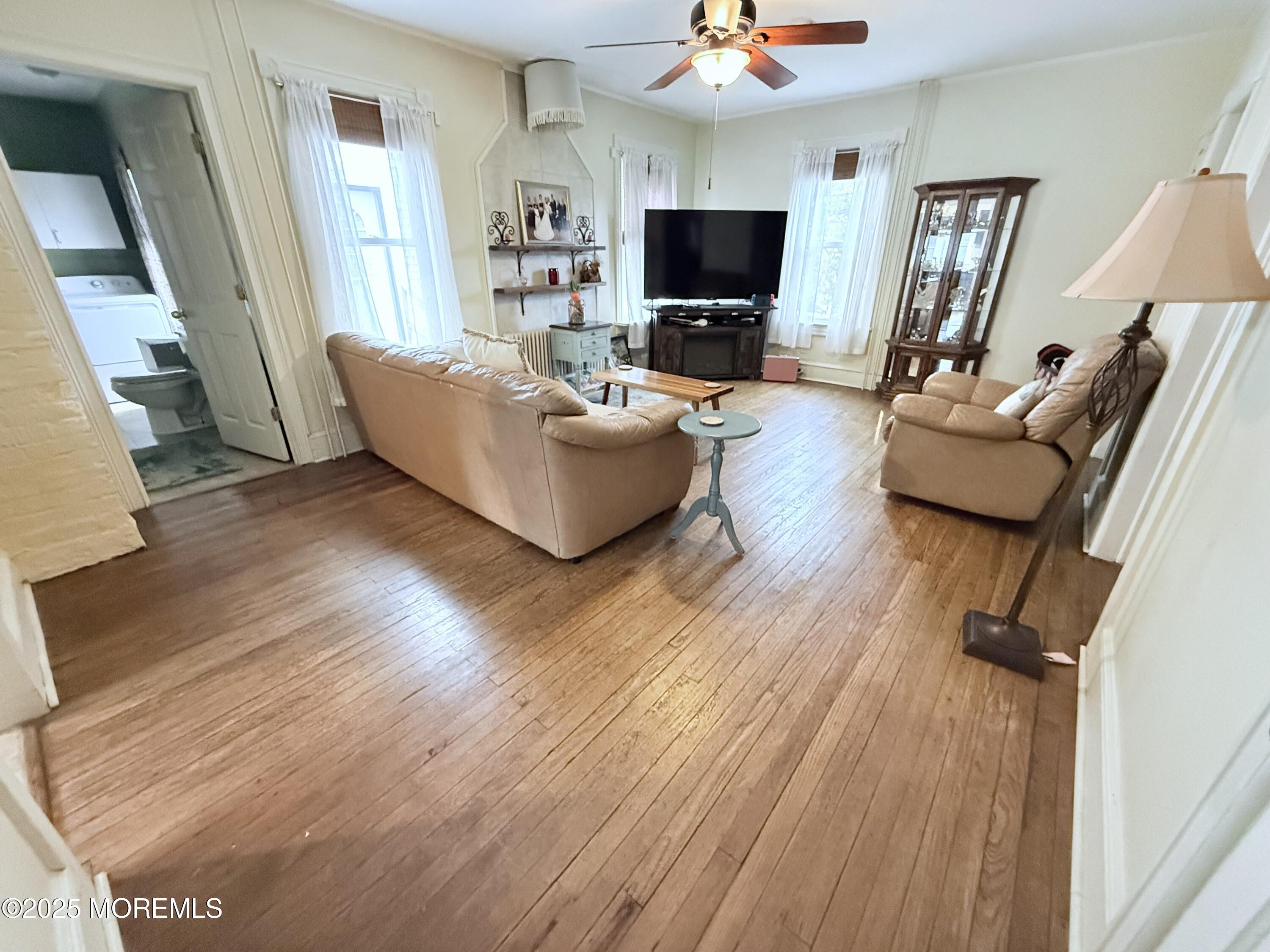 479 Line Road Matawan, NJ 07747 - Photo 22 of 32 a living room with furniture and a flat screen tv