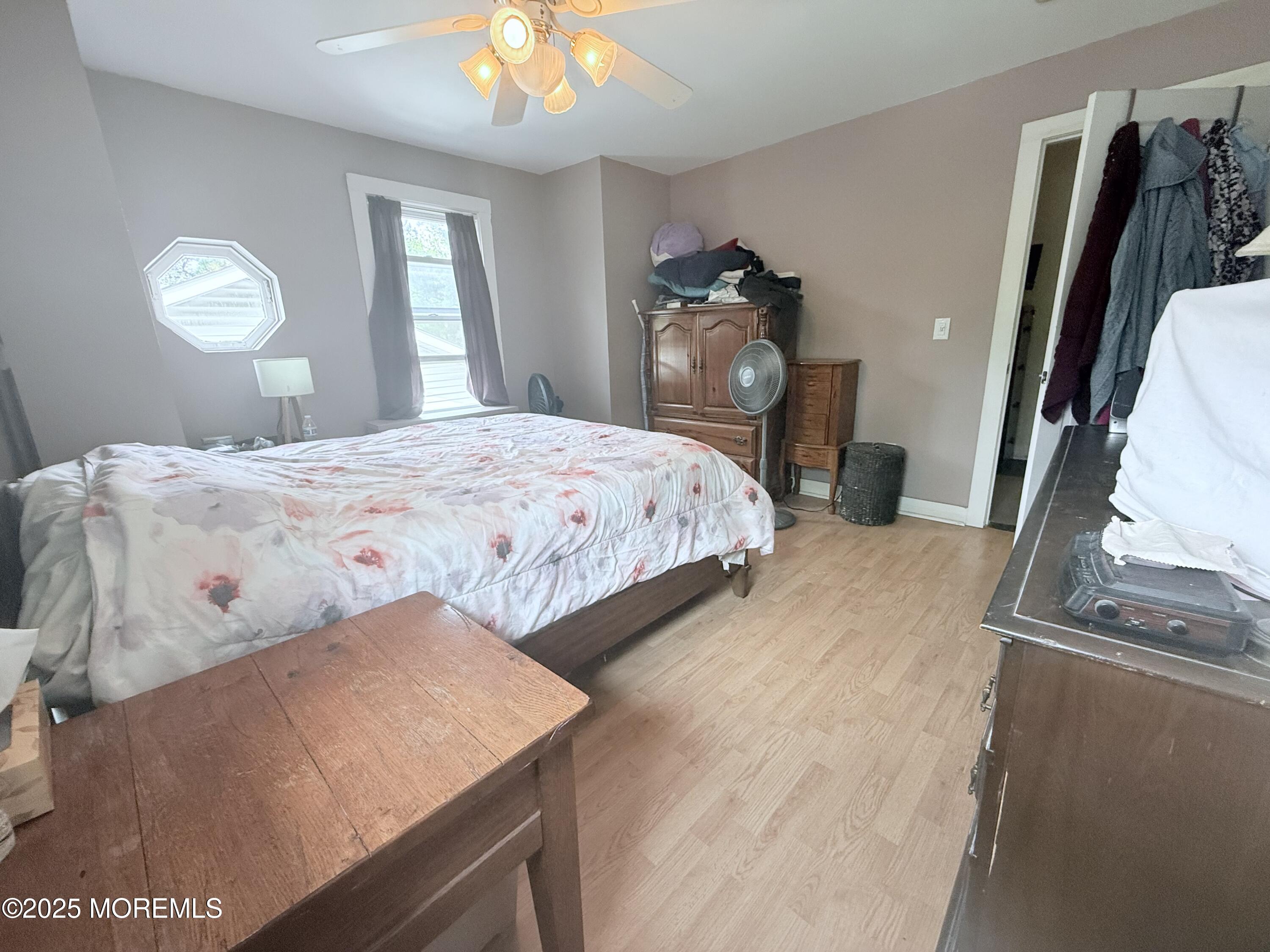 479 Line Road Matawan, NJ 07747 - Photo 29 of 32 a bedroom with a bed and a mirror