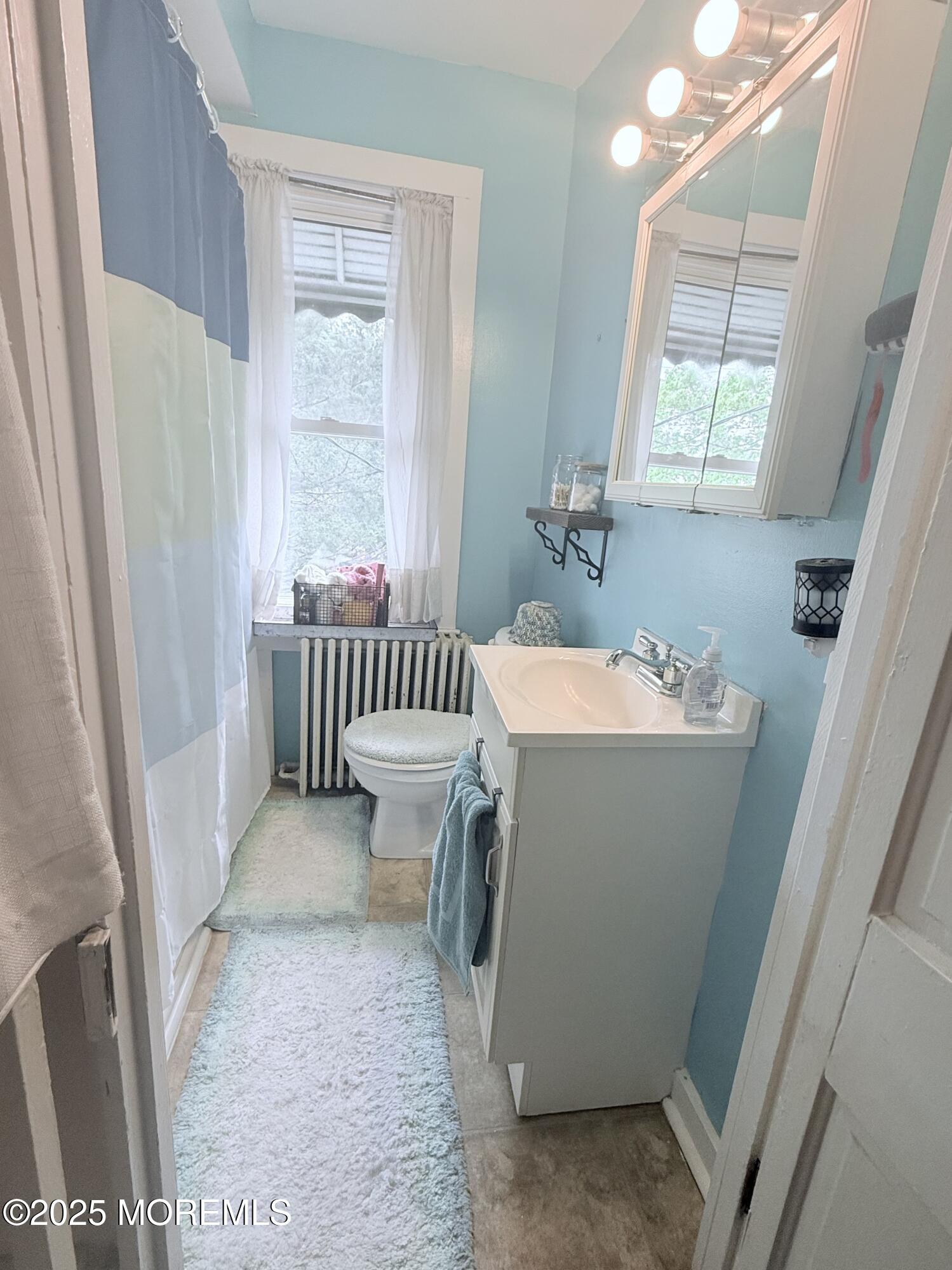 479 Line Road Matawan, NJ 07747 - Photo 32 of 32 a bathroom with a sink a toilet a window and tub