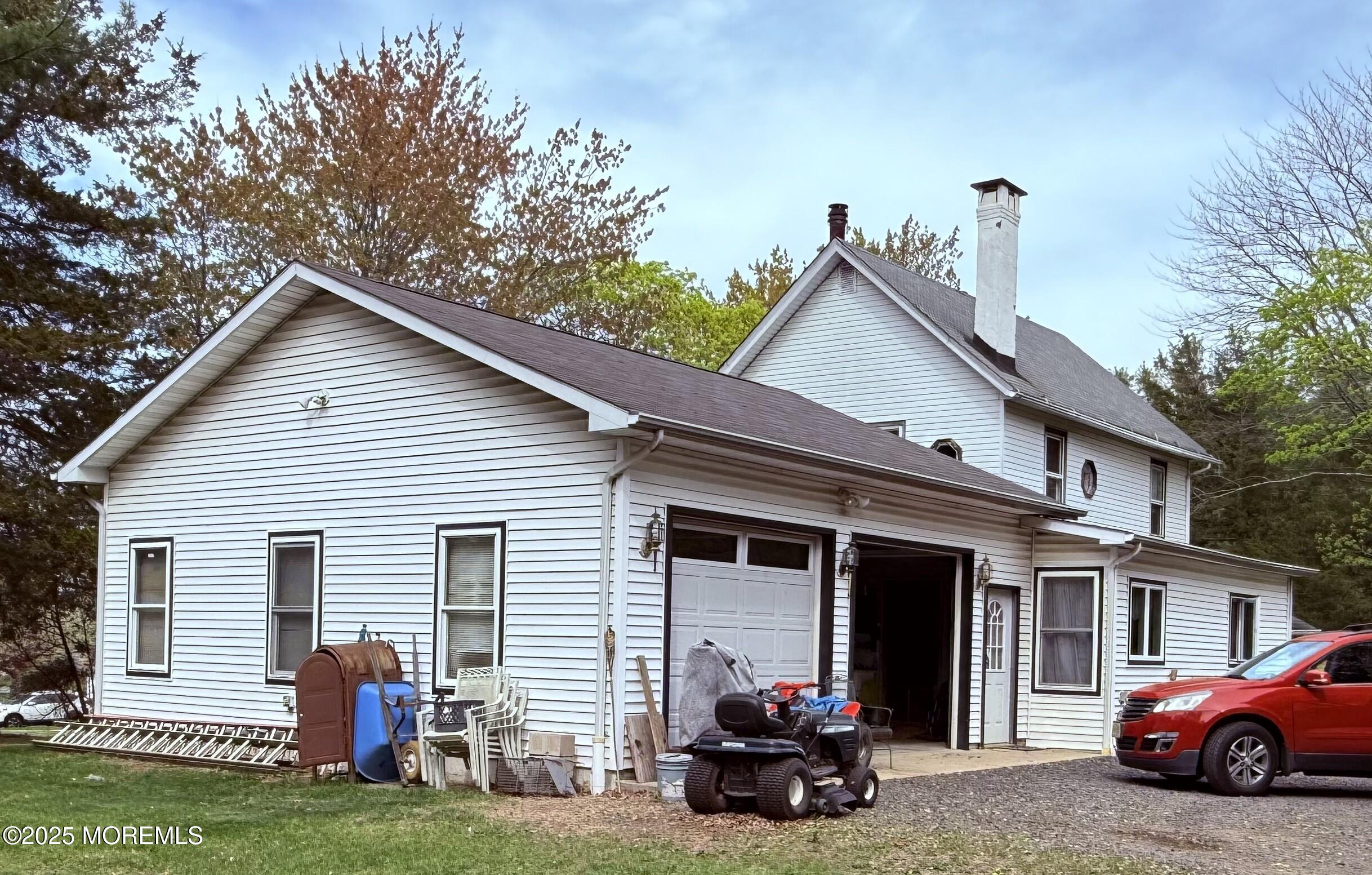 479 Line Road Matawan, NJ 07747 - Photo 5 of 32 a view of a house with a patio