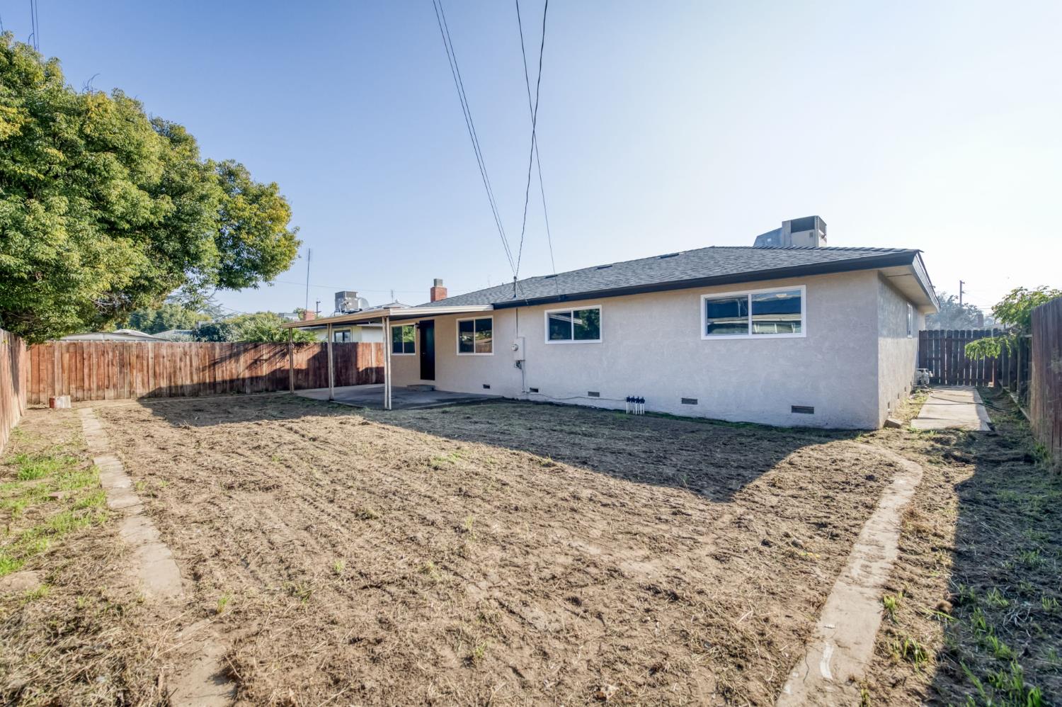 4031 East Pontiac Way Fresno, CA 93726 - Photo 31 of 46 a house view with a backyard space
