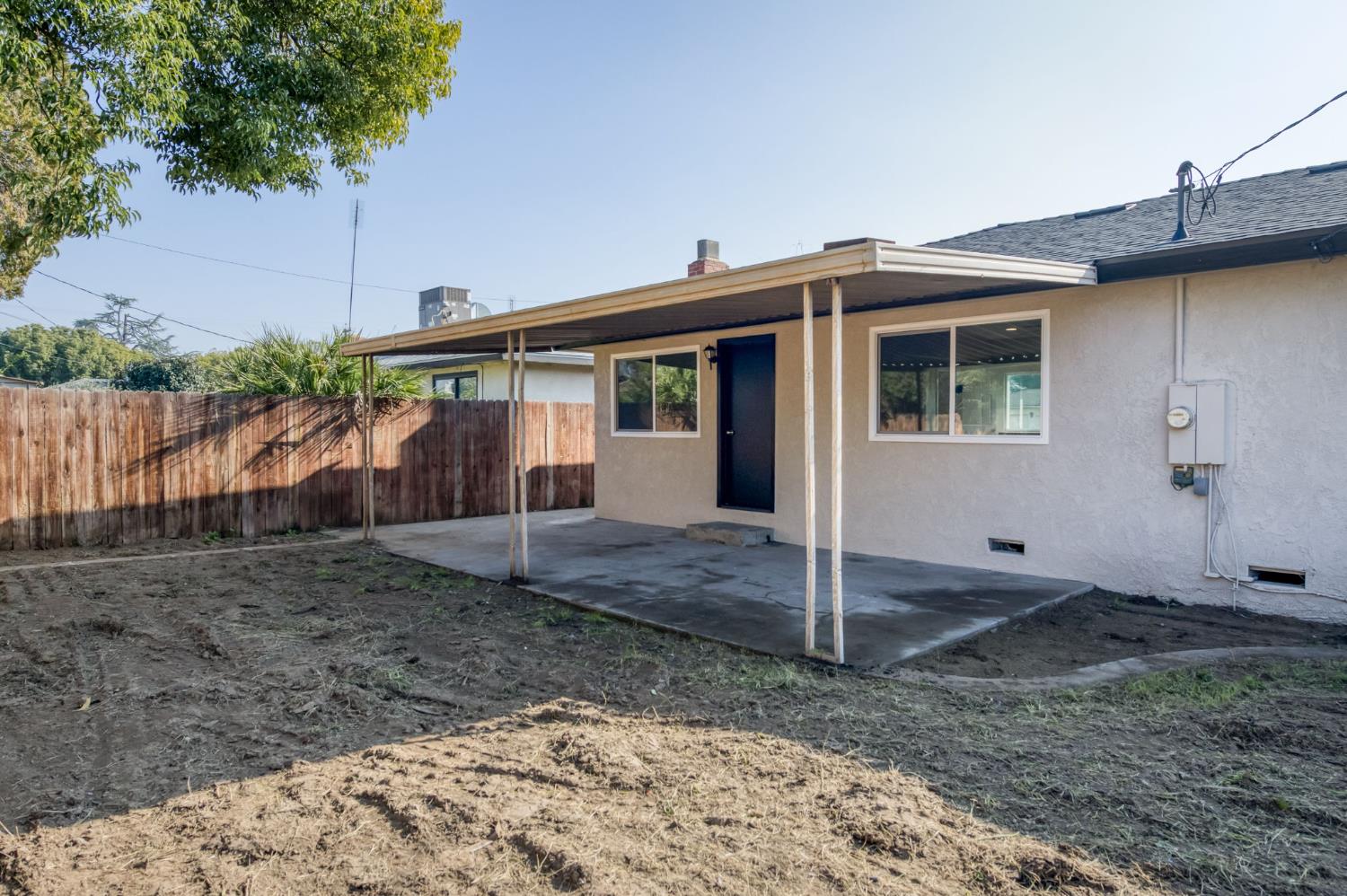 4031 East Pontiac Way Fresno, CA 93726 - Photo 32 of 46 a view of a house with a backyard