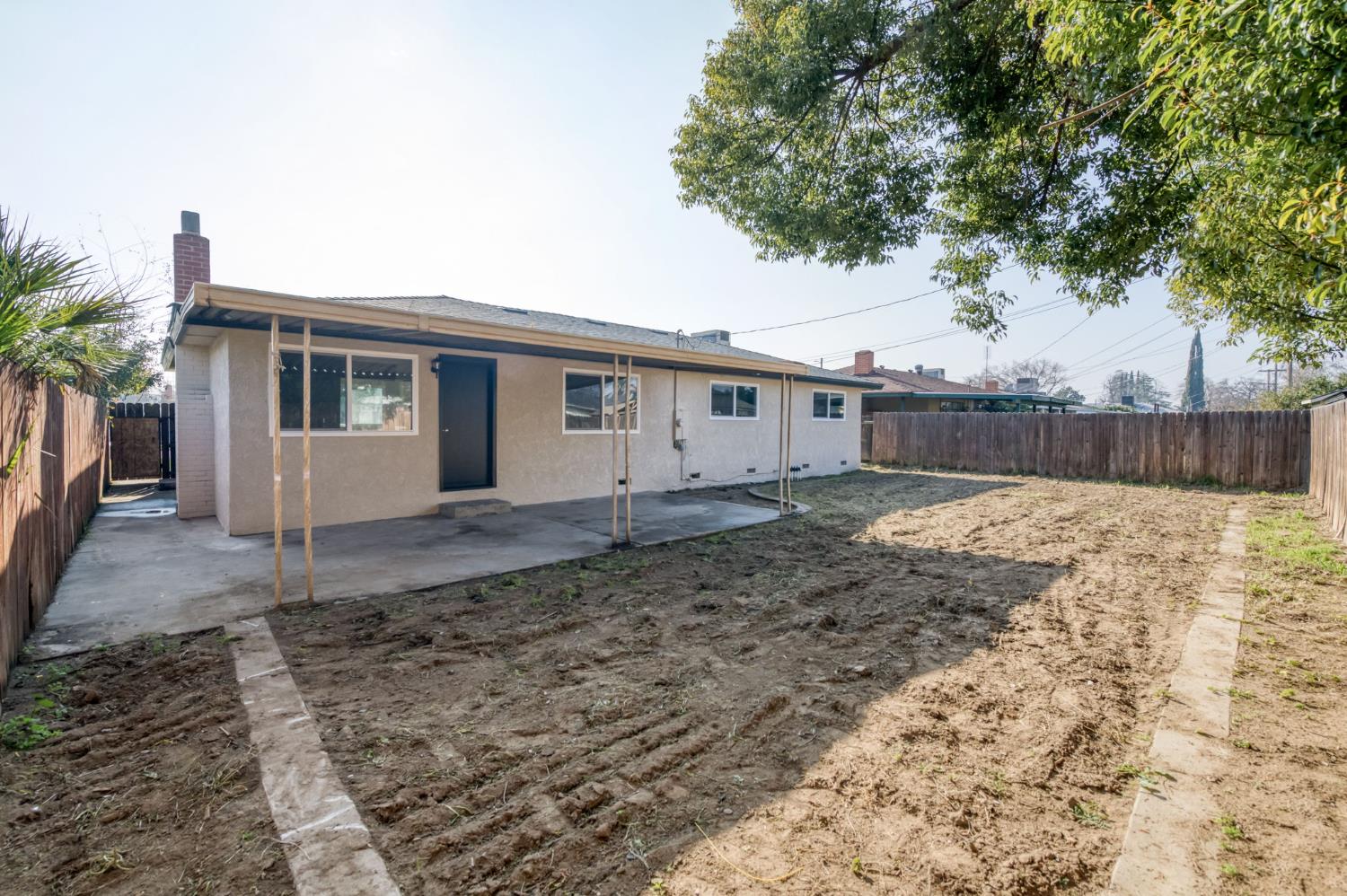 4031 East Pontiac Way Fresno, CA 93726 - Photo 33 of 46 a view of a house with a yard