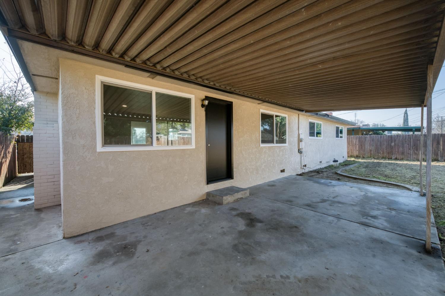 4031 East Pontiac Way Fresno, CA 93726 - Photo 34 of 46 a view of backyard with large window