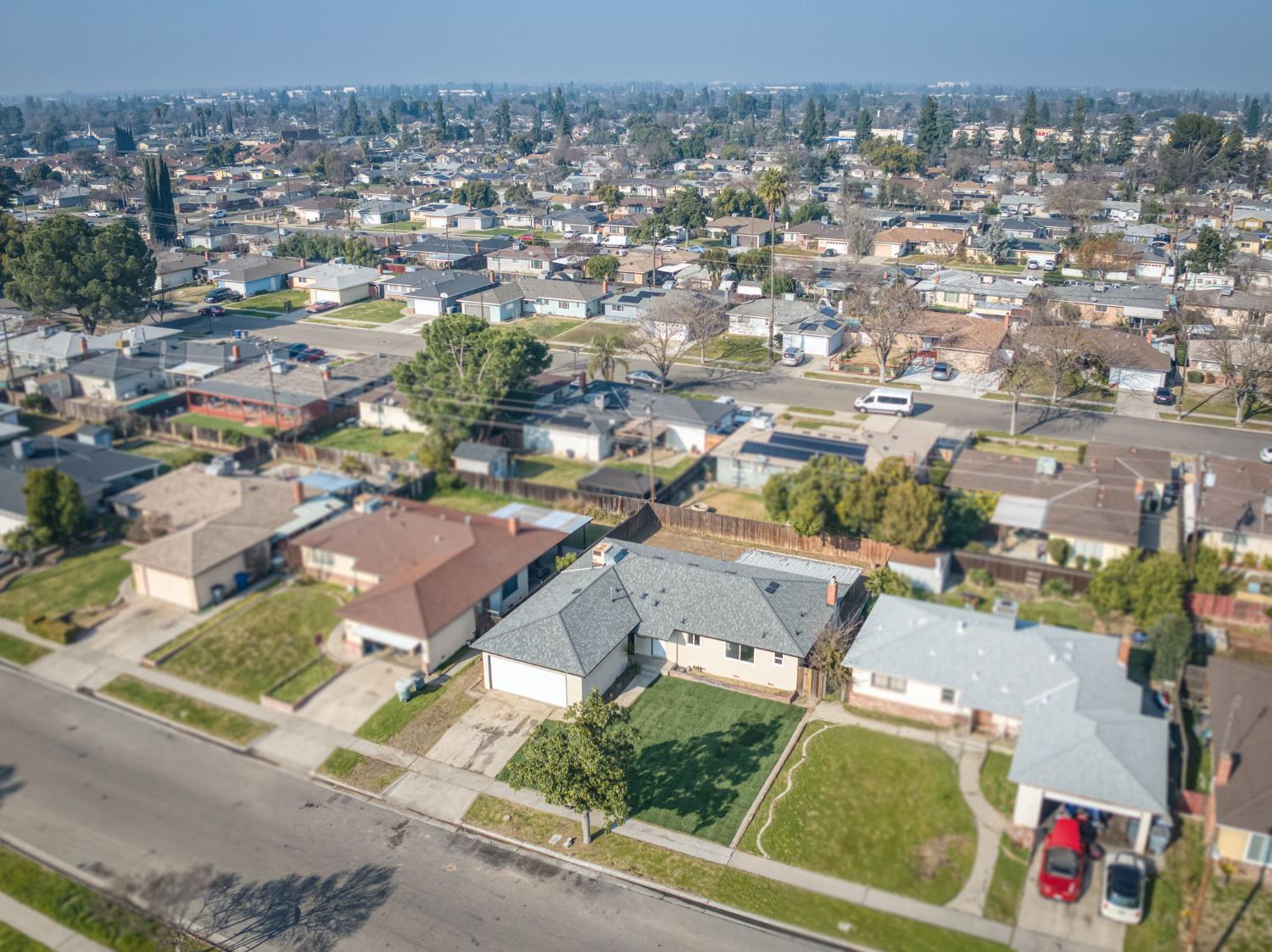 4031 East Pontiac Way Fresno, CA 93726 - Photo 44 of 46 an aerial view of residential houses with outdoor space