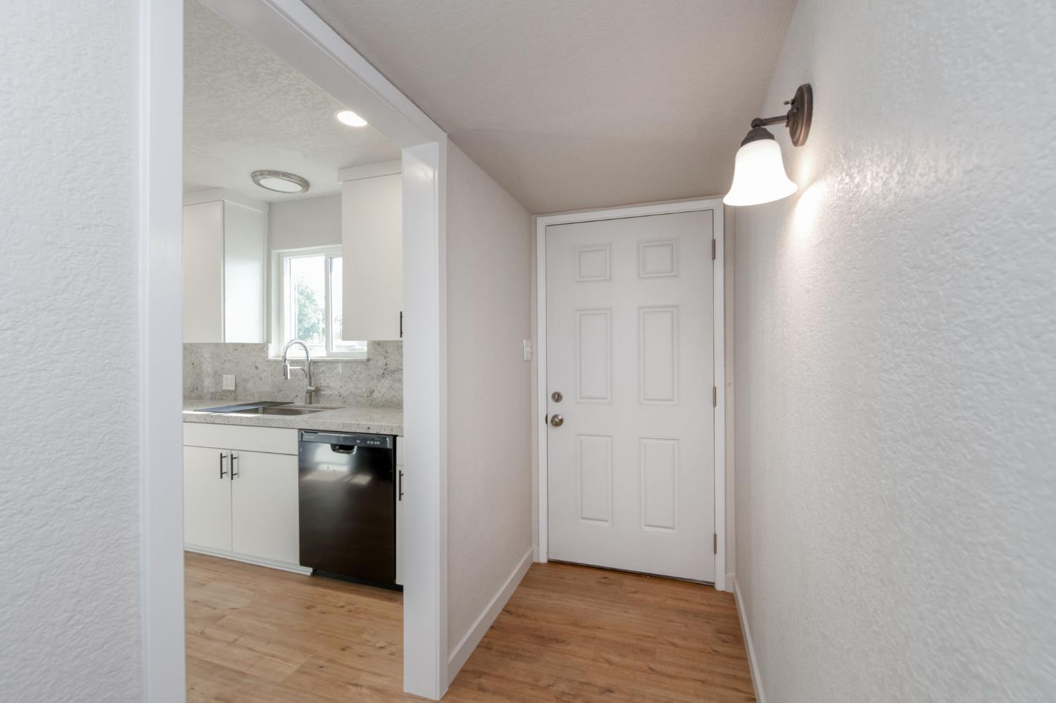 4031 East Pontiac Way Fresno, CA 93726 - Photo 9 of 46 a en suite bathroom with a granite countertop sink and a mirror