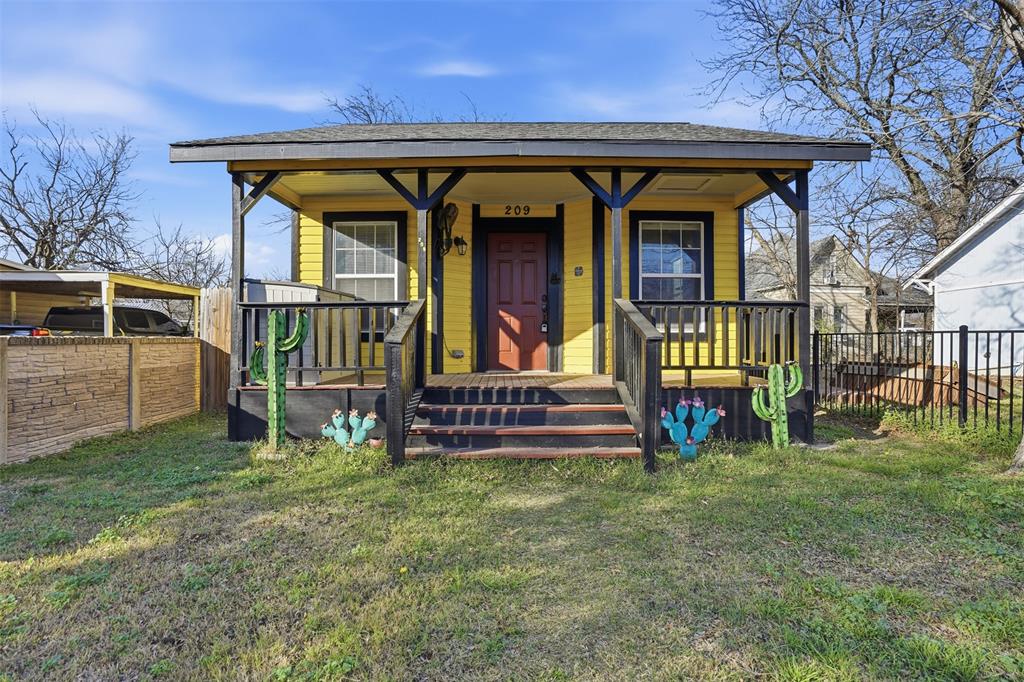 a view of front door and small house