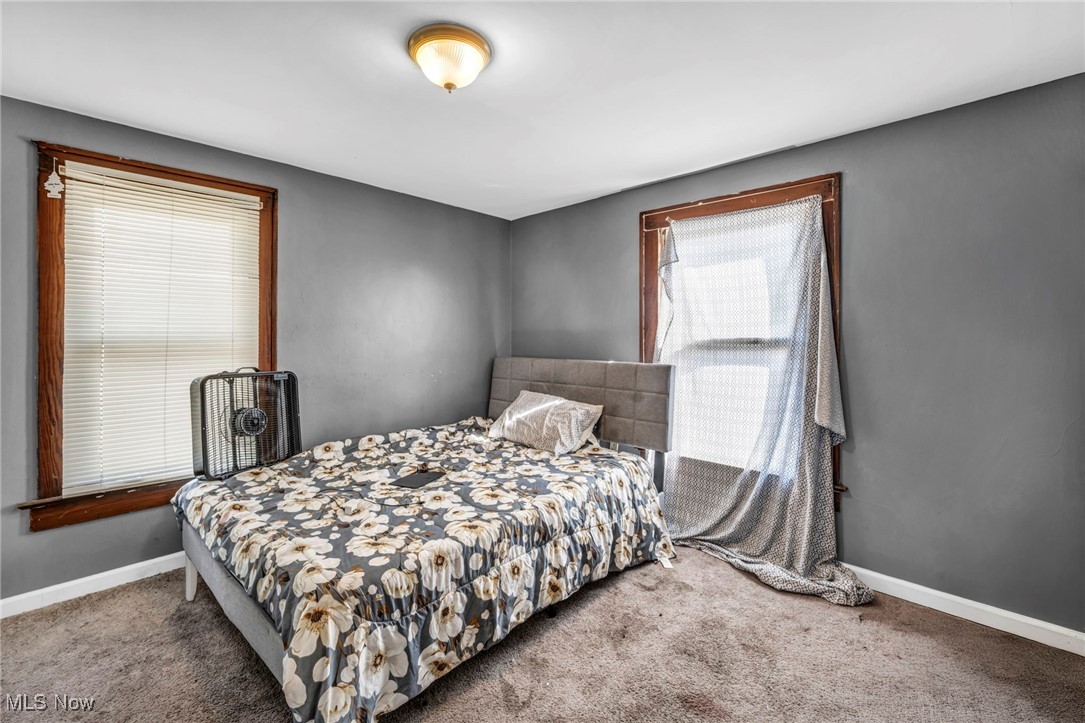 1107 West Wilbeth Road Akron, OH 44314 - Photo 16 of 50 Carpeted bedroom featuring baseboards