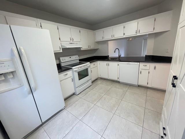 6373 Boca Circle Boca Raton, FL 33433 - Photo 13 of 22 a kitchen with cabinets and white appliances