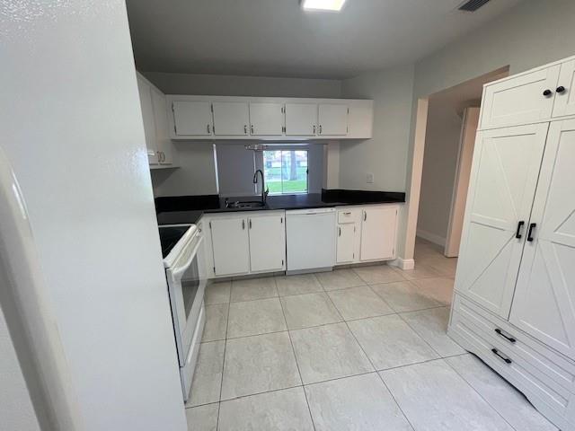 6373 Boca Circle Boca Raton, FL 33433 - Photo 14 of 22 a kitchen with granite countertop a sink a stove and cabinets