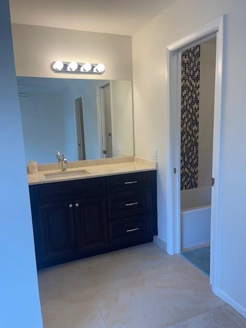 6373 Boca Circle Boca Raton, FL 33433 - Photo 17 of 22 a bathroom with a double vanity and a mirror