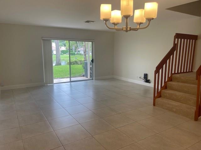 6373 Boca Circle Boca Raton, FL 33433 - Photo 4 of 22 a view of an empty room with a chandelier fan