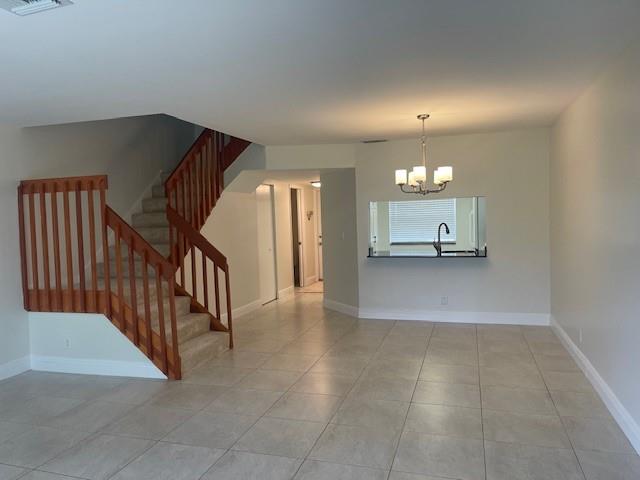 6373 Boca Circle Boca Raton, FL 33433 - Photo 5 of 22 a view of a hallway with a chandelier