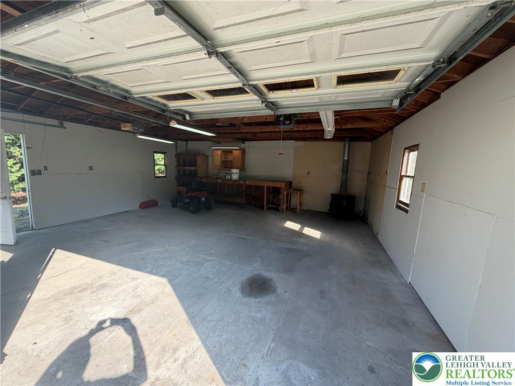 5720 Memorial Road Germansville, PA 18053 - Photo 20 of 29 A spacious garage provides ample room for vehicles and a dedicated workbench area.
