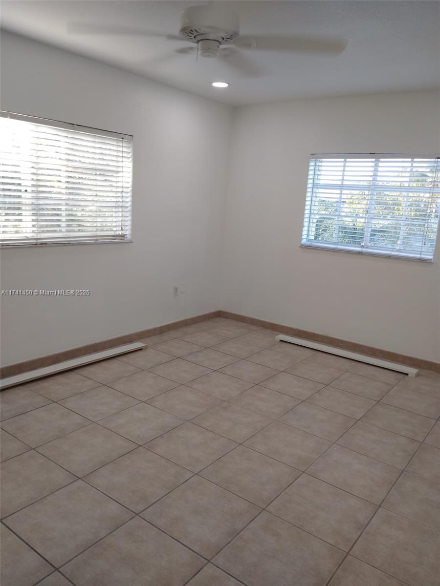 7775 West 29th Way, Unit 201 Hialeah, FL 33018 - Photo 12 of 14 a view of an empty room with a window