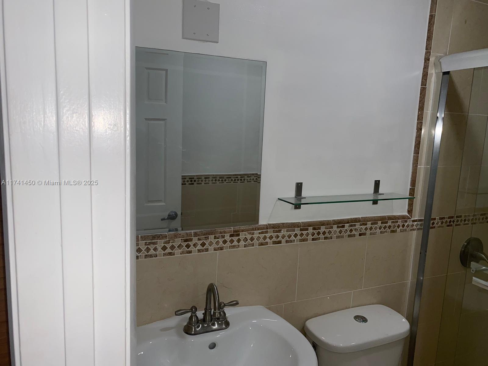 7775 West 29th Way, Unit 201 Hialeah, FL 33018 - Photo 14 of 14 a bathroom with a toilet and a sink