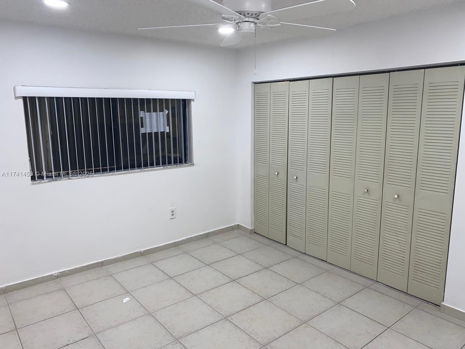 7775 West 29th Way, Unit 201 Hialeah, FL 33018 - Photo 2 of 14 en empty room with windows