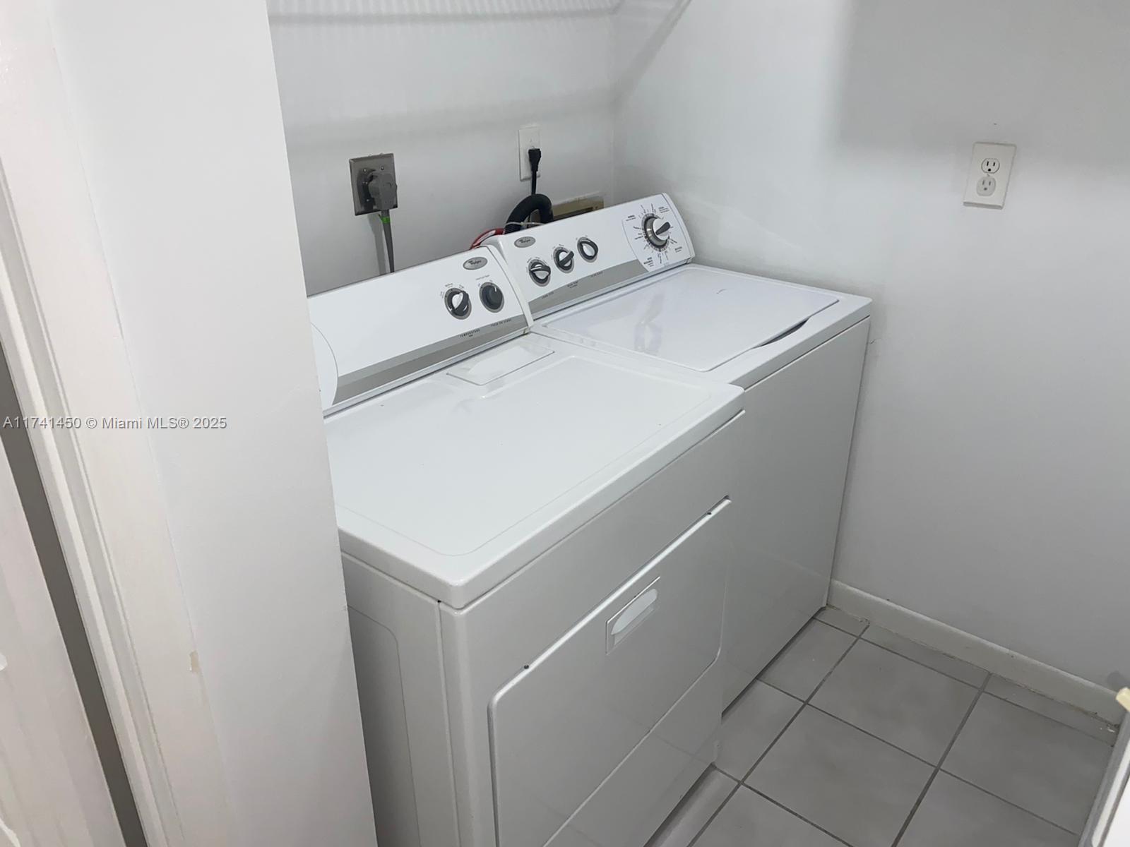 7775 West 29th Way, Unit 201 Hialeah, FL 33018 - Photo 9 of 14 a utility room with dryer and washer