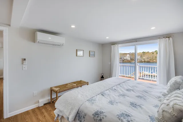 a bedroom with a bed and a night stand