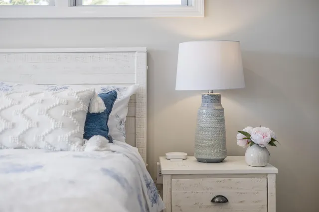 a bedroom with a bed and a chair